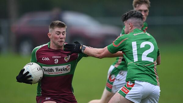 Castlerea St. Kevin's midfielder Michael Conroy tries to fend off the challenge of St. Brigid's forward Kealan Byrne during Sunday's intermediate football championship quarter-final in Ballyleague. Pic. Gerard O'Loughlin Castlerea St. Kevin's midfielder Michael Conroy tries to fend off the challenge of St. Brigid's forward Kealan Byrne during Sunday's intermediate football championship quarter-final in Ballyleague. Pic. Gerard O'Loughlin