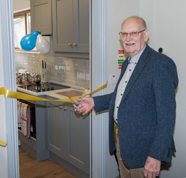 Treasurer of Drumlion Community Council Padraig McWeeney cuts the tape officially opening the new kitchen facility. Pic. Gerry Faughnan Treasurer of Drumlion Community Council Padraig McWeeney cuts the tape officially opening the new kitchen facility. Pic. Gerry Faughnan