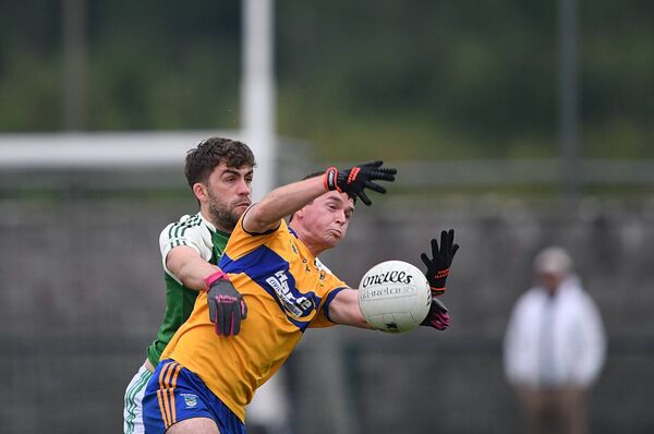 Ciarán McHugh and Pauric Halpin battle for possession during Sunday's Junior A football championship quarter-final at Kilmore. 
