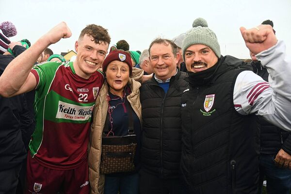 Shane, Geraldine and James Keenan, and James Thompson, toast Castlerea St. Kevin's provincial final success at Tuam Stadium. 