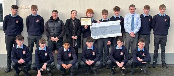  Transition Year students with Andrea Fitzgerald of Galway Simon Community. 