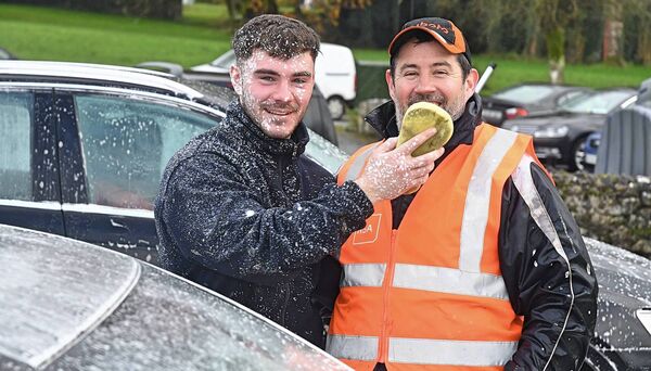 Brian Keane and Mickey Joe Egan, having fun at a car wash in Knockcroghery village as a fundraiser for St. Dominic’s GAA Club. Pic. Gerard O’Loughlin