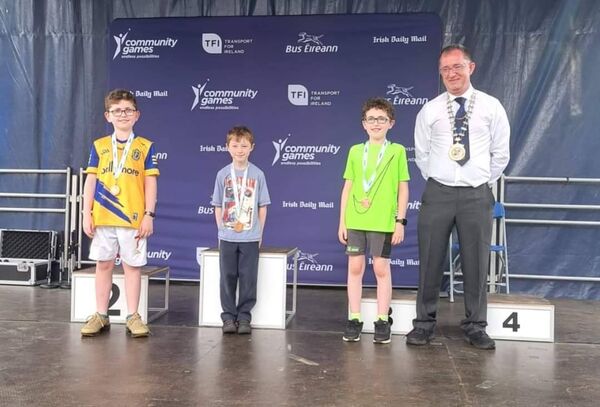 The Croghan/Drumlion/Cortober U-11 project team of Jack McGowan, Dara McGroarty and Liam McGroarty, with National President Gerry McGuinness, that won fourth place medals at the national finals of Community Games in Carlow.