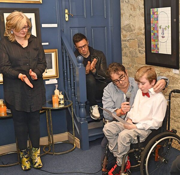 George Naughton pictured addressing the launch of his first solo art exhibition at Anam Art Gallery, Roscommon Town, dedicating the exhibition to his late brother Archie, who died last year. Also in picture are George’s parents Paula and Padraic and The Blizzards frontman, Niall Breslin, who launched the exhibition. Pic. Gerard O’Loughlin