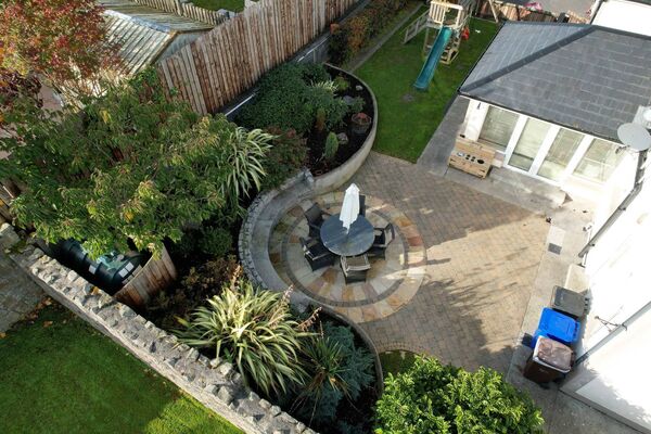Externally there is a large south facing paved patio area to the rear. 