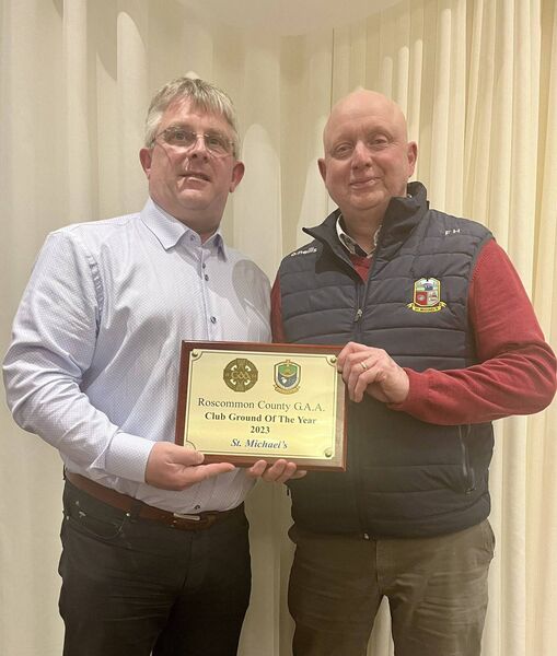 St. Michael's Chairperson, Eddie Heslin, receives the Roscommon GAA Club Grounds of the Year award from Frank Egan. Picture: Courtesy of Roscommon GAA