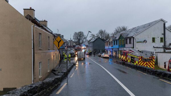 Damage to roofs on left and right. Damage to street lighting and cars. Emergency services deal with the aftermath. Pic. Gerry Faughnan Damage to roofs on left and right. Damage to street lighting and cars. Emergency services deal with the aftermath. Pic. Gerry Faughnan