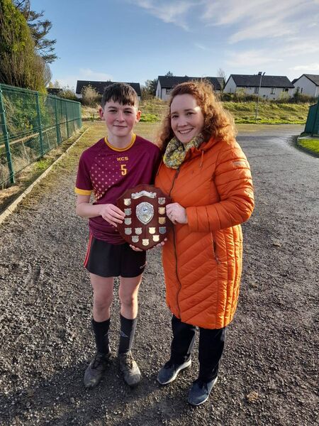 Thomas Duffy, captain of Whitehall NS, receives the Peter Kelly Memorial Shield from Ms Hazel Hannon, Lanesboro Community College Principal. Thomas Duffy, captain of Whitehall NS, receives the Peter Kelly Memorial Shield from Ms Hazel Hannon, Lanesboro Community College Principal.