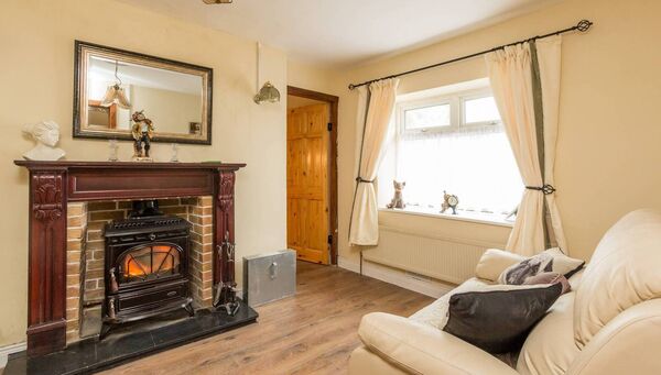 The sitting room with open fire.
