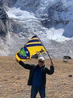 Gay pictured flying the Rossie flag at Mount Everest base camp. He went there while at a wedding in Nepal in 2019. Gay pictured flying the Rossie flag at Mount Everest base camp. He went there while at a wedding in Nepal in 2019.