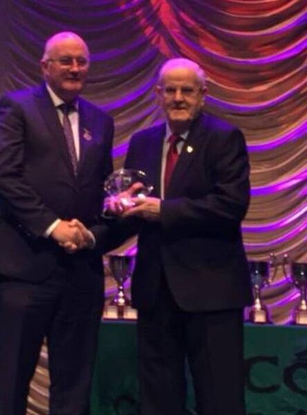 Phonsie Tully receives his Lifetime Achievement award for his contribution to Scór from GAA President John Horan at the 2019 Scór na nÓg finals in Castlebar. Phonsie Tully receives his Lifetime Achievement award for his contribution to Scór from GAA President John Horan at the 2019 Scór na nÓg finals in Castlebar.