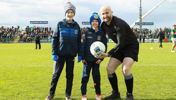 March 2023: Cillian and Joseph Belton present the match ball to referee Brendan Cawley before the Roscommon v Mayo game at Hyde Park, Roscommon on Sunday. Pic. Bernie O'Farrell March 2023: Cillian and Joseph Belton present the match ball to referee Brendan Cawley before the Roscommon v Mayo game at Hyde Park, Roscommon on Sunday. Pic. Bernie O'Farrell