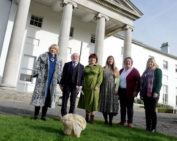 The Irish Seed Savers Association presenting President Michael D. Higgins and Sabina Higgins with the Lough Key Crab tree in memory of the President's dog Bród, who passed away last year.