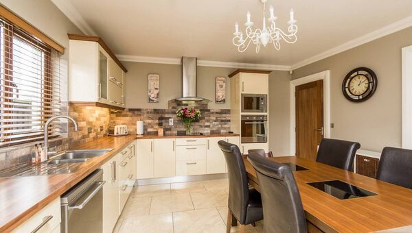The kitchen/dining room has ample space and storage.