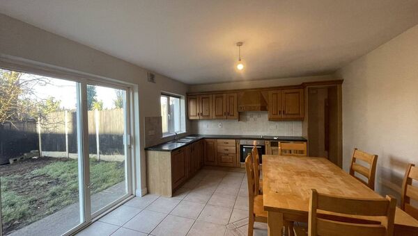 The kitchen has double doors leading to the garden. The kitchen has double doors leading to the garden.