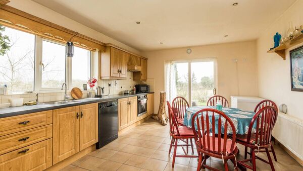The kitchen has double doors leading to the garden.