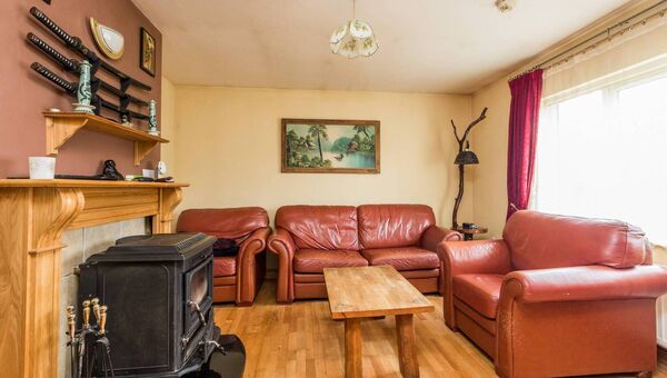 The sitting room has a stove inset.