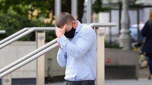 Swimming coach jailed for secretly filming young girls admits attacking cameraman outside court