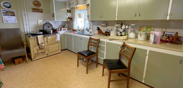 The kitchen area has a range.