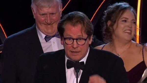 Philip Dolan (background) on stage at the IFTA in Dublin after ‘That They May Face The Rising Sun’ won Best Film award. Philip Dolan (background) on stage at the IFTA in Dublin after ‘That They May Face The Rising Sun’ won Best Film award.