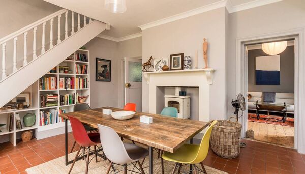 The dining area with inset stove and plenty of storage.
