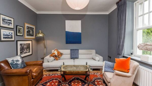 The cosy sitting room has views to the garden.