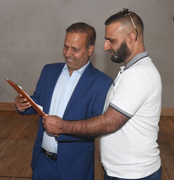 Independent candidate Sajjad Hussain and Rashid Hussain from Ballaghaderreen having a look at the figures to see how they stack up. Pic. Gerard O'Loughlin