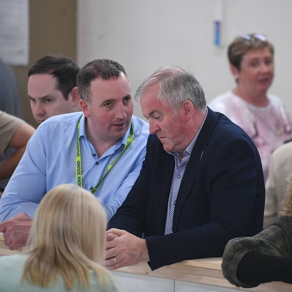 Former FF councillor Ivan Connaughton in deep discussion with outgoing Cllr John Cummins at the Roscommon count centre. Pic. Gerard O'Loughlin
