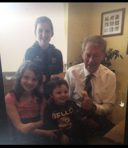 Mícheál Ó Muircheartaigh with the Osgood Daly children during his visit to their home. Mícheál Ó Muircheartaigh with the Osgood Daly children during his visit to their home.