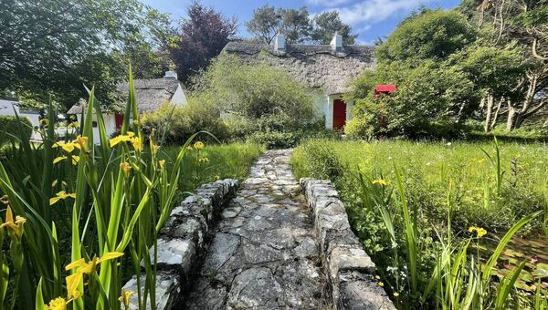 There is an attractive pathway leading from the edge of the site through a mature garden over a feature stone bridge. There is an attractive pathway leading from the edge of the site through a mature garden over a feature stone bridge.