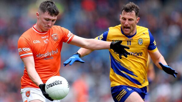 Diarmuid Murtagh tries to stop Armagh’s Oisín Conaty. Pic. ©INPHO/James Crombie Diarmuid Murtagh tries to stop Armagh’s Oisín Conaty. Pic. ©INPHO/James Crombie