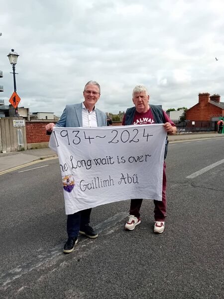 Mountbellew man Gerry Rushe had the flag of the day at Croke Park on the day of Galway’s win over Dublin and he asked GAA President Jarlath Burns to hold the historic flag with him. Mountbellew man Gerry Rushe had the flag of the day at Croke Park on the day of Galway’s win over Dublin and he asked GAA President Jarlath Burns to hold the historic flag with him.