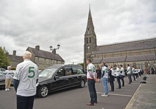 Ballaghaderreen GAA club members form a guard of honour as the funeral cortege of the late  John O'Mahony made its way from St Nathy's Cathedral to Kilcolman Cemetery. Pic. Conor McKeown
