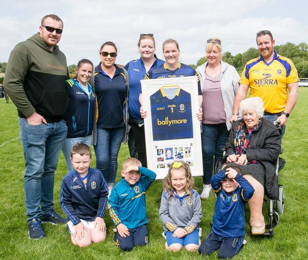 Helena Cummins, who made her 103rd appearance for the Roscommon intermediate ladies’ football team during the All-Ireland quarter-final against Leitrim, with member of her family. Pictured are back row (l-r): Ryan Cummins, Melissa Martin, Michelle Leonard, Siobhan Cummins, Helena Cummins, Maureen Cummins, and Shane Cummins. Front row (l-r): John Cummins, Rian Cummins, Molly Cummins, Tadhg Cummins and Mary Kelly. Pictures: Michelle Hughes Walsh Helena Cummins, who made her 103rd appearance for the Roscommon intermediate ladies’ football team during the All-Ireland quarter-final against Leitrim, with member of her family. Pictured are back row (l-r): Ryan Cummins, Melissa Martin, Michelle Leonard, Siobhan Cummins, Helena Cummins, Maureen Cummins, and Shane Cummins. Front row (l-r): John Cummins, Rian Cummins, Molly Cummins, Tadhg Cummins and Mary Kelly. Pictures: Michelle Hughes Walsh