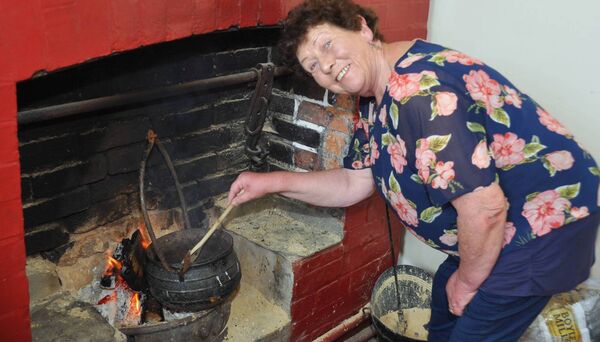 Noleen Dowling going back to basics on Heritage Day in Ballintubber. Pic. Liam Reynolds