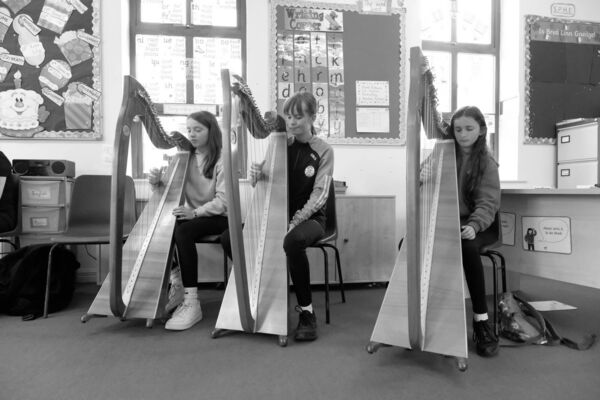 Emily McNamara, Katie McNamara and Caoimhe Bailey pictured taking part in harp classes during the 44th annual O'Carolan Harp Festival and Summer School in Keadue. Picture: David Knight