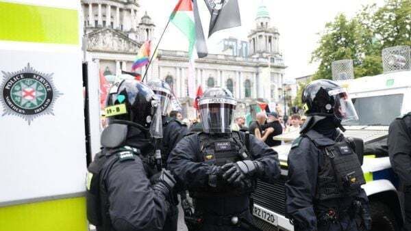 Violent clashes and businesses attacked amid anti-immigration protest in Belfast