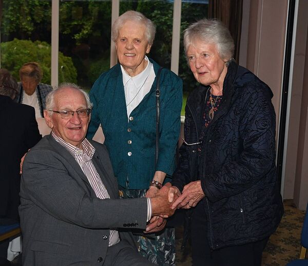 Ursula Butler and Mae McManus pictured with Fr. Michael Hickey at a party in Fr. Hickey’s honour in the Shamrock Lodge Hotel, Athlone.