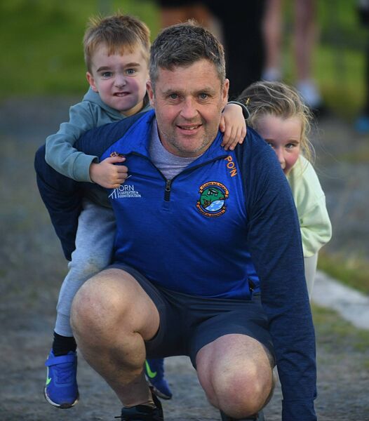 Phelim O’Neill with twins Ken and a camera shy Cára O’Neill during last Friday evening's U-14 Division One football final between Clann na nGael and Pádraig Pearses. Picture: Gerard O'Loughlin Phelim O’Neill with twins Ken and a camera shy Cára O’Neill during last Friday evening's U-14 Division One football final between Clann na nGael and Pádraig Pearses. Picture: Gerard O'Loughlin
