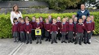 Road contractors present defibrillator to County Roscommon school