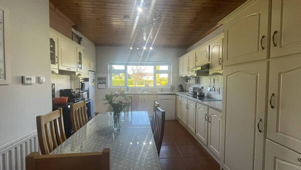 The property has a modern and bright kitchen with ample storage.