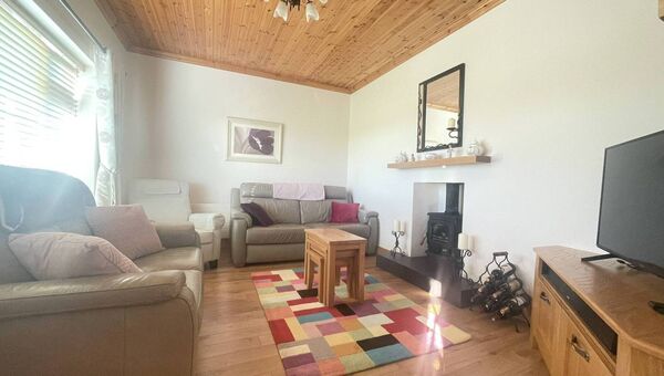 The cosy sitting room complete with stove.