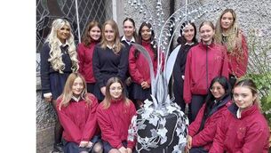 <p>Pictured alongside the Forged Friendship sculpture are Fifth Year students. Back row: Anna Regan, Maria Fox, Hannah Corcoran, Elia Cormican, Laura Marques, Mia White, Lilly Murray and Ava Clyne. Front row: Sumaya Magomayev, Roksana Majek, Dana Gutierrez and Lauren Kilroe. </p>