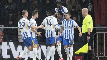 Ten-man Brighton survive anxious finish to edge out Bournemouth