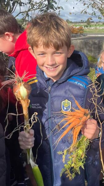 Harry Dolan with some of the vegetables grown at Ballintleva NS.