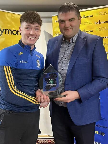 Shane McGinley is presented with his Eirgrid U-20 Player of the Province Award by Roscommon GAA Chairperson, Brian Carroll, in the Abbey Hotel on Friday week last. Picture: Courtesy of Roscommon GAA