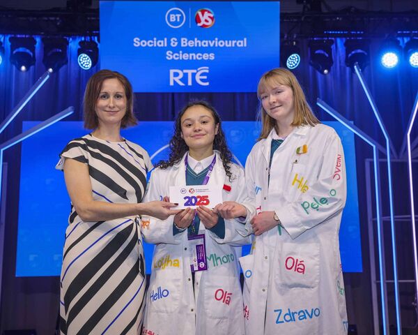 Therese Gunning, Legal Director at BT Ireland presents the third place Intermediate Group Social and Behavioural Sciences Category Award at the 61st BT Young Scientist &amp; Technology Exhibition (BTYSTE) to Alicia Nic an Bhaird, and Julia Kuczwalska, Roscommon Community College, Roscommon for the project 'Words Without Walls: Exploring The Emotional Impact Of Language Barriers On Students'. Alicia and Julia also won the Ombudsman for Children's Award for their project.