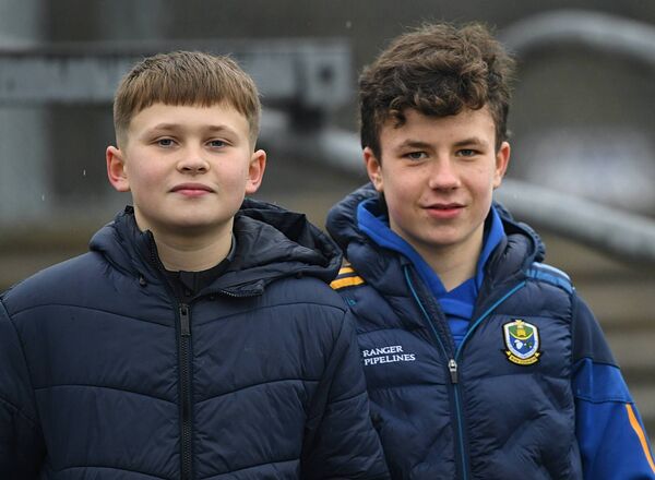 Seán Rock and Joshua Lohan getting behind the Roscommon senior footballers against Down at King and Moffatt Dr. Hyde Park on Sunday last. 