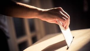 <p>Conceptual image of a person voting, casting a ballot at a polling station, during elections.</p> <p>Conceptual image of a person voting, casting a ballot at a polling station, during elections.</p>