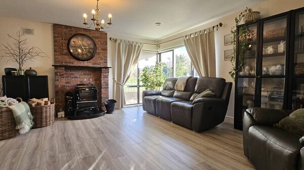 The sitting room is south facing and is bright and airy with a feature corner window.